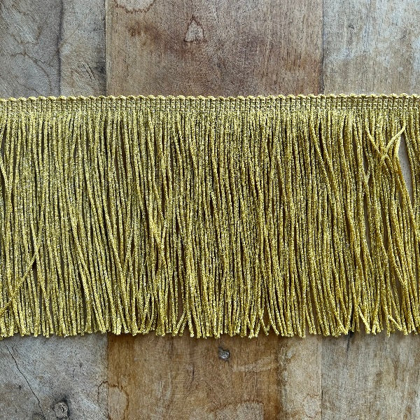 frangia per abiti in tripolino colore lurex alta 15 centimetri da cucire. Ideale per abbellire componenti per la casa come tovaglie o tende e vestiti fai da te oppure costumi